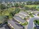 Charming villas nestled on a golf course with well-maintained landscaping and nearby community amenities at 3213 Archer Ave, The Villages, FL 32162