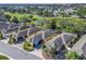 Beautiful aerial view of homes next to a golf course showcasing lush greenery and a serene neighborhood at 3213 Archer Ave, The Villages, FL 32162