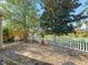 Charming backyard with white picket fence, stone ground cover and golf course views at 3213 Archer Ave, The Villages, FL 32162