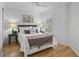 Charming bedroom with a large window providing natural light and beautiful hard wood floors at 3213 Archer Ave, The Villages, FL 32162