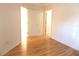 Empty bedroom featuring wood floors, and natural light at 3213 Archer Ave, The Villages, FL 32162