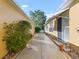 Welcoming home exterior with a well-maintained walkway, lush greenery, and a charming entrance at 3213 Archer Ave, The Villages, FL 32162