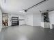 Spacious garage equipped with laundry machines, storage, and ample parking at 3213 Archer Ave, The Villages, FL 32162