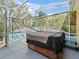 Relax in this screened-in hot tub with waterfall mural for the ultimate backyard retreat at 3213 Archer Ave, The Villages, FL 32162
