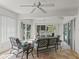 Inviting sunroom featuring tile flooring, ceiling fans, and sliding glass doors at 3213 Archer Ave, The Villages, FL 32162