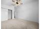 Bright bedroom with ceiling fan and spacious closet at 4287 Fredda Ter, The Villages, FL 32163