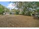 Large backyard with chicken coop and open space at 505 W Catawba St, Fruitland Park, FL 34731