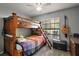 Bedroom with bunk beds and guitar at 505 W Catawba St, Fruitland Park, FL 34731