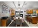 Dining room boasts an open layout with a rustic table, bar seating, and seamless flow to the kitchen at 505 W Catawba St, Fruitland Park, FL 34731