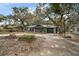 House exterior with a basketball hoop and spacious yard at 505 W Catawba St, Fruitland Park, FL 34731