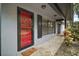 Red door entry with black shutters and walkway at 505 W Catawba St, Fruitland Park, FL 34731