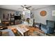 Spacious living room with comfortable seating and wood flooring at 505 W Catawba St, Fruitland Park, FL 34731