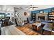 Inviting living room with a cozy fireplace and comfortable seating arrangement at 505 W Catawba St, Fruitland Park, FL 34731