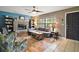 Inviting living room featuring a stone fireplace, built-in bookshelves, and cozy seating at 505 W Catawba St, Fruitland Park, FL 34731