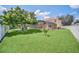Expansive backyard with lush green grass and mature trees provides ample space for recreation at 6607 Crestmont Glen, Windermere, FL 34786