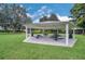 Community picnic pavilion with picnic tables and green space for residents to enjoy at 6607 Crestmont Glen, Windermere, FL 34786