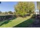 Lush backyard with well-maintained lawn and mature trees at 1018 Green Gate Blvd, Groveland, FL 34736