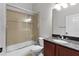 Bathroom featuring granite vanity, a toilet, and a tiled shower-tub combo at 1018 Green Gate Blvd, Groveland, FL 34736