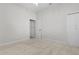 Bedroom featuring soft carpet, a ceiling fan, a closet, and a door at 1018 Green Gate Blvd, Groveland, FL 34736