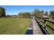 Community dock and boat slips in a waterfront neighborhood with lush, green lawn at 1018 Green Gate Blvd, Groveland, FL 34736
