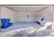 Spacious two-car garage with bright lighting, storage and a coated floor at 1018 Green Gate Blvd, Groveland, FL 34736