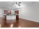 Spacious room includes the open kitchen concept and hardwood floors at 1018 Green Gate Blvd, Groveland, FL 34736