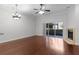 Living room with hardwood floors, fireplace and access to a patio at 1018 Green Gate Blvd, Groveland, FL 34736