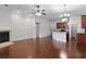 Spacious room includes the open kitchen concept, hardwood floors, and fireplace at 1018 Green Gate Blvd, Groveland, FL 34736