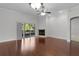 Bright living room with hardwood floors, fireplace, and sliding doors leading to a patio at 1018 Green Gate Blvd, Groveland, FL 34736