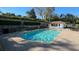 Beautiful community pool with sun loungers, umbrellas, and a bath house for residents to enjoy at 1018 Green Gate Blvd, Groveland, FL 34736