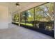 Relaxing screened porch overlooking a lush backyard at 1018 Green Gate Blvd, Groveland, FL 34736