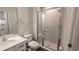 Clean bathroom with a walk-in shower and white vanity at 1710 Summer Rose Dr, Mount Dora, FL 32757