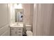 Bathroom featuring a modern vanity, mirror, and toilet at 1710 Summer Rose Dr, Mount Dora, FL 32757
