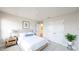 A serene bedroom showcasing a neutral palette, plush bedding, and stylish bedside decor at 1710 Summer Rose Dr, Mount Dora, FL 32757