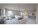 Spacious bedroom featuring a sitting area, soft carpeting, and a doorway to the ensuite bathroom at 1710 Summer Rose Dr, Mount Dora, FL 32757