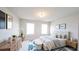 Cozy bedroom with a comfortable king-sized bed and natural light at 1710 Summer Rose Dr, Mount Dora, FL 32757