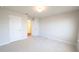 A bright, unfurnished bedroom ready for personalization, featuring neutral carpets at 1710 Summer Rose Dr, Mount Dora, FL 32757