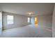 Unfurnished carpeted room bathed in natural light, ideal for use as a bedroom at 1710 Summer Rose Dr, Mount Dora, FL 32757