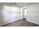 Bright bedroom with wood-look flooring, neutral walls and entry to bathroom at 1710 Summer Rose Dr, Mount Dora, FL 32757