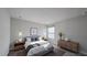Tastefully decorated bedroom with pendant lighting, featuring hardwood night stands and a stylish dresser at 1710 Summer Rose Dr, Mount Dora, FL 32757