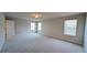 Expansive bonus room with neutral carpet, natural light, and adaptable space at 1710 Summer Rose Dr, Mount Dora, FL 32757
