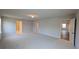 Large bonus room with neutral carpet and walls and multiple door openings for versatile use at 1710 Summer Rose Dr, Mount Dora, FL 32757