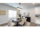 Bright dining room featuring modern light fixture, decor, and window with natural light at 1710 Summer Rose Dr, Mount Dora, FL 32757
