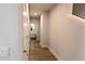 Hallway featuring a tiled bathroom with a modern vanity and fixtures at 1710 Summer Rose Dr, Mount Dora, FL 32757