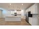 Modern kitchen featuring white cabinets, stainless steel appliances, and a large center island at 1710 Summer Rose Dr, Mount Dora, FL 32757