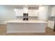 Kitchen island with white quartz countertop and pendant lighting at 1710 Summer Rose Dr, Mount Dora, FL 32757