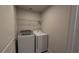A compact laundry area equipped with a modern washer and dryer set, ready for use at 1710 Summer Rose Dr, Mount Dora, FL 32757