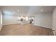Spacious open concept living room and kitchen with modern stainless steel appliances at 1710 Summer Rose Dr, Mount Dora, FL 32757