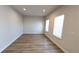 Bright and airy living room with light walls and wood-look flooring at 1710 Summer Rose Dr, Mount Dora, FL 32757
