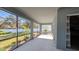 View of patio with screen windows and view of the fenced backyard at 1710 Summer Rose Dr, Mount Dora, FL 32757